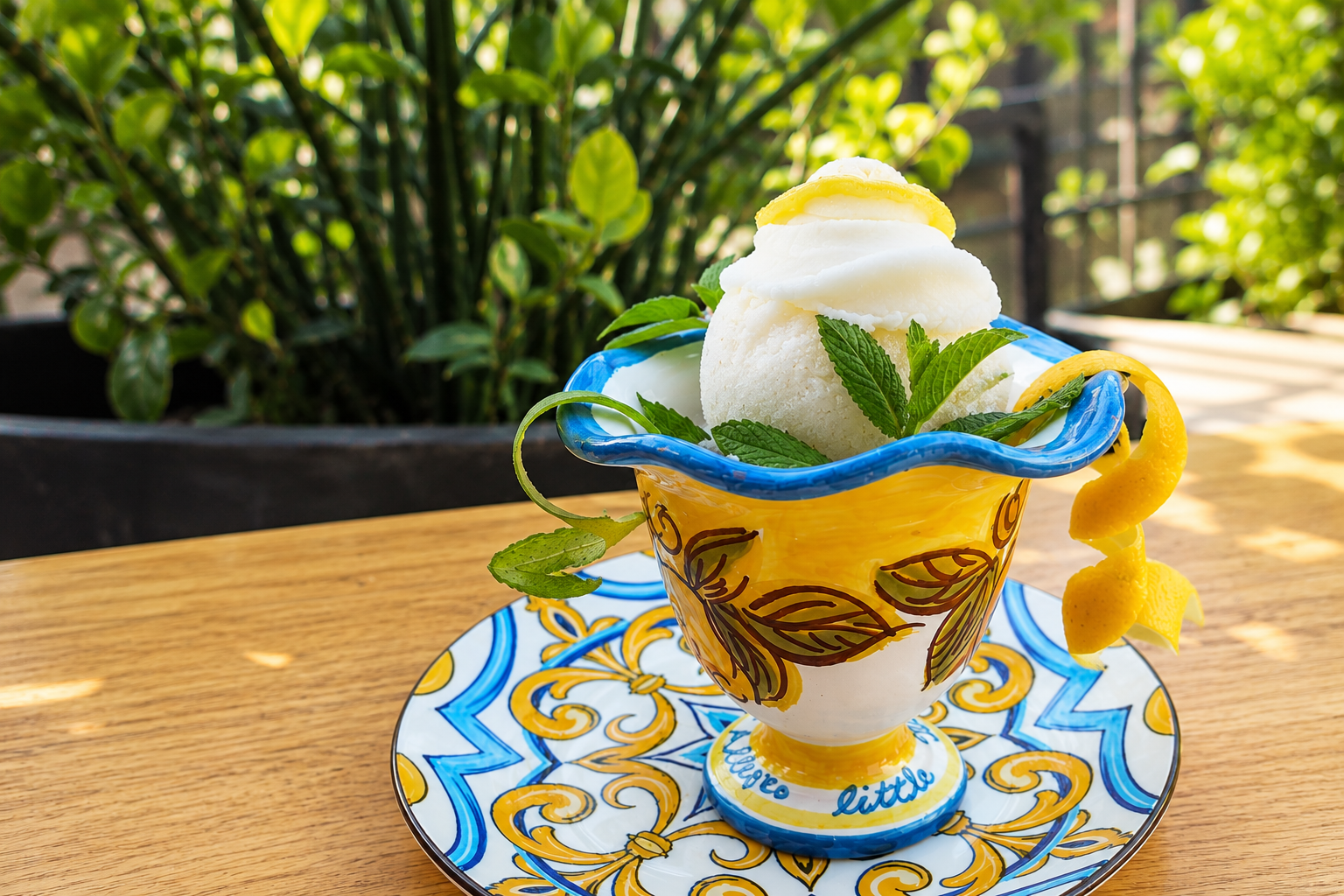 Lemon sorbet served in a hand-painted Italian ceramic bowl at Allegro Little Italy